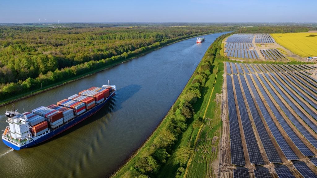 Freight transport moving through industrial infrastructure
